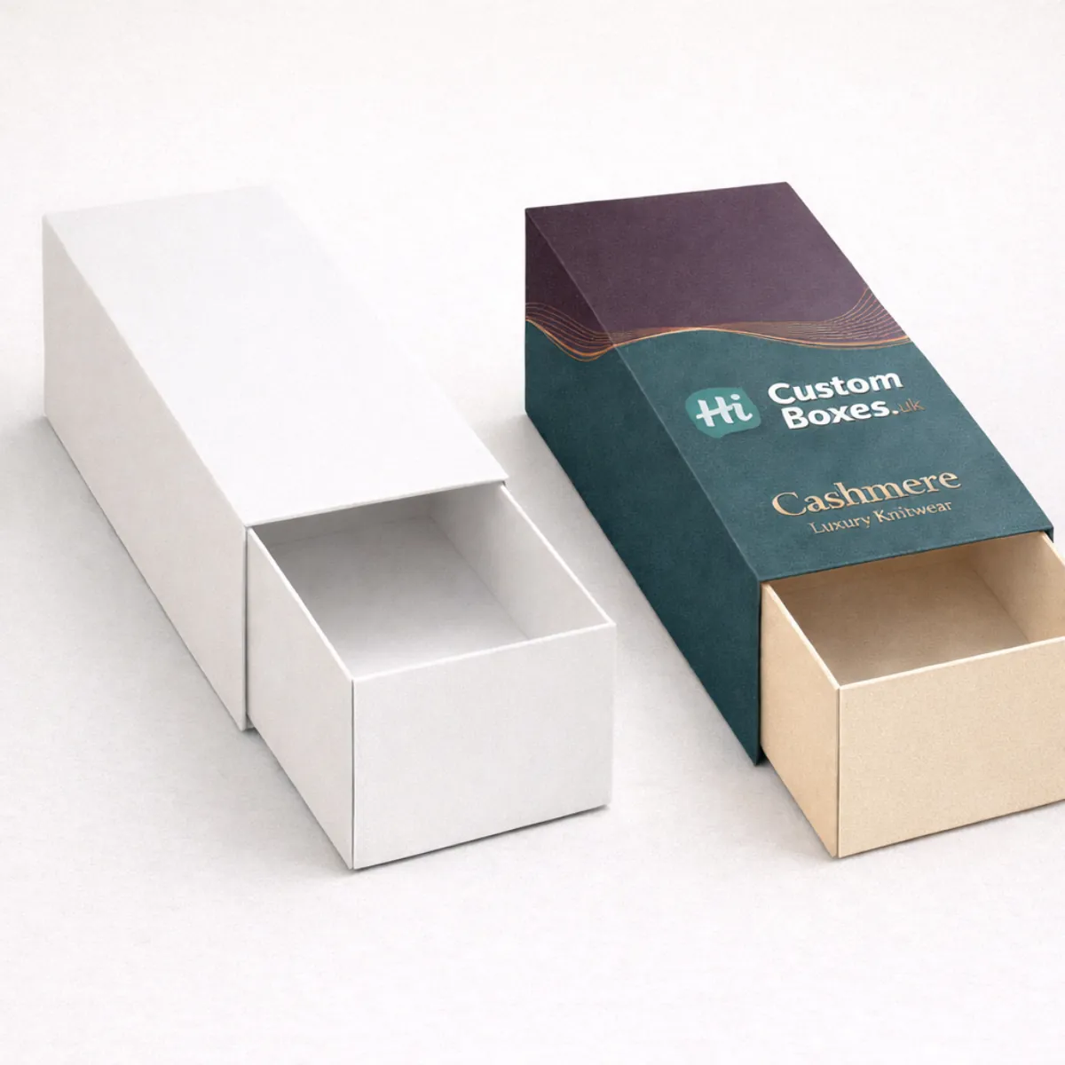 Two elegant sliding drawer boxes- one solid white and one branded teal with a cream-coloured inner tray- class=